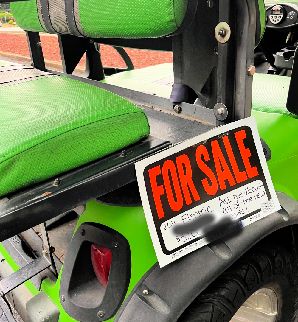 black and green golf cart