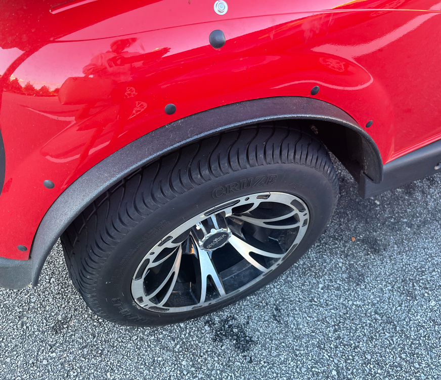 thin golf cart fender flares on a red EZ GO golf cart